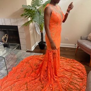 Size medium dress, very long train, vibrant orange color.